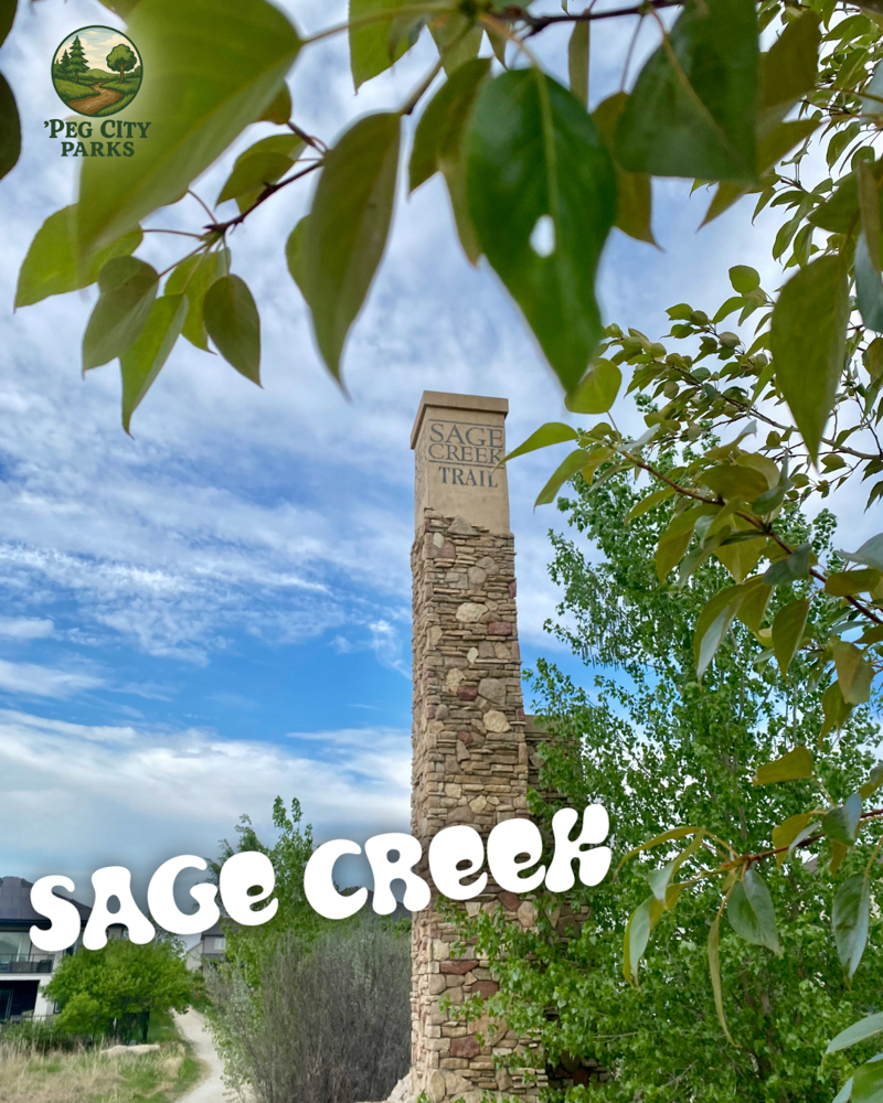 Image of a a stone pillar surrounded by greenery in Sage Creek.